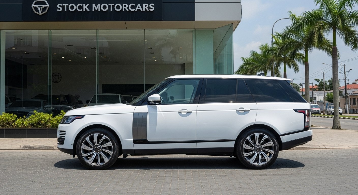 2022 Range Rover Autobiography in pearl white outside Stock Motorcars showroom